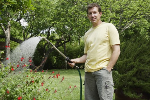 Preparing soil for flower bed creation in Carshalton